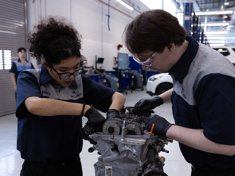 HondaPACT students working on engine